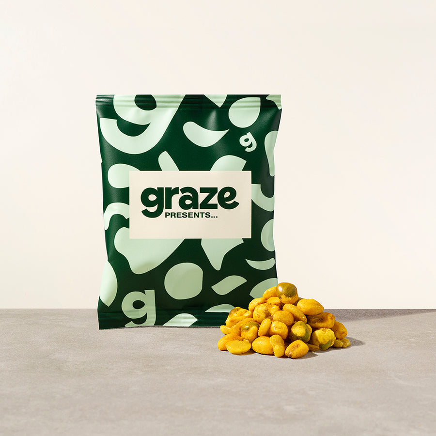 a bag of graze katsu crunch next to a pile of the product