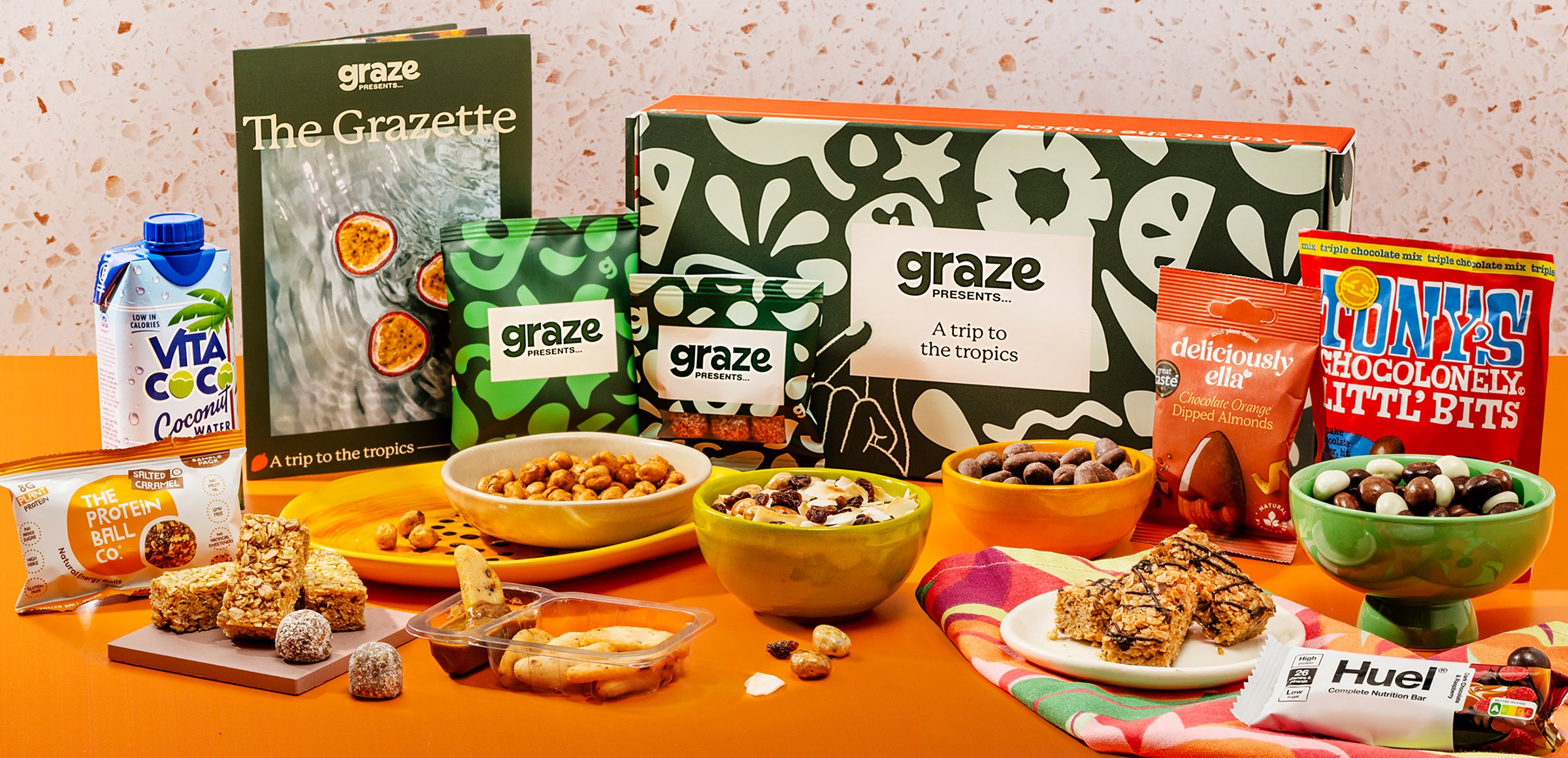 Graze Presents 'a garden in bloom' box contents laid out like a picnic on a plain white surface