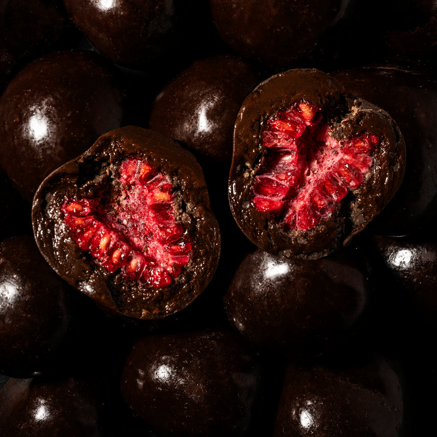 Dark chocolate coated raspberries halved