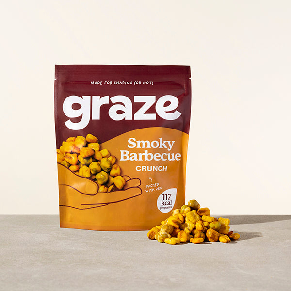 a sharing bag of graze smoky barbecue crunch snack next to a small pile of the product